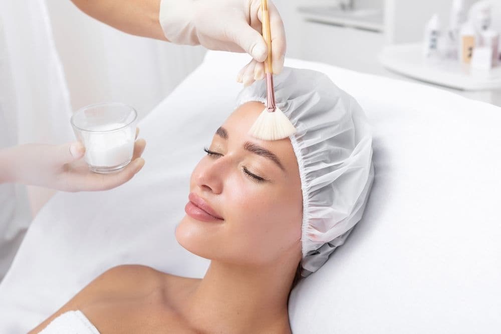 Client receiving a facial peel treatment