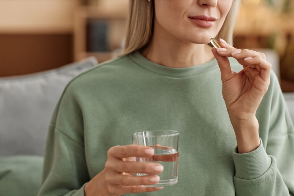 Patient taking ADK-10 vitamins with water