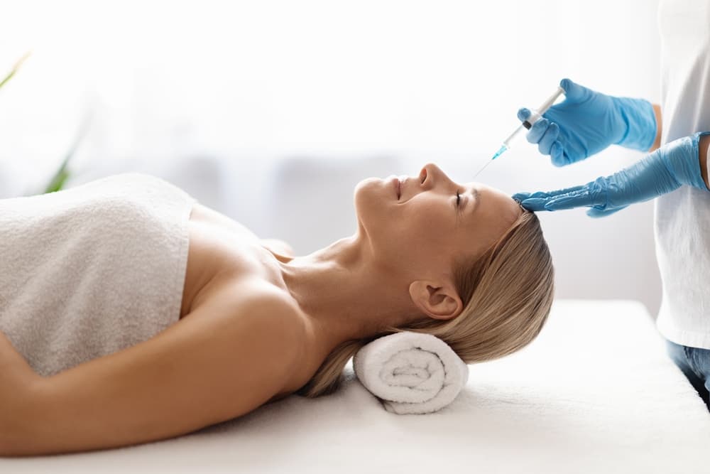 Patient receiving an injectable aesthetic treatment